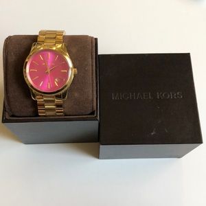 Michael Kors gold woman’s watch with pink face